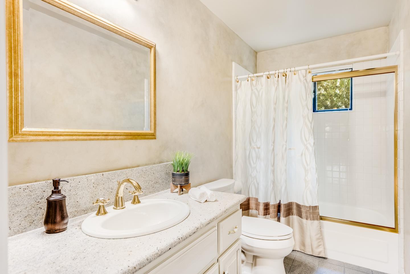 757 Harry Road San Jose, CA 95120 - Photo 32 of 60 a bathroom with a sink a toilet and a mirror