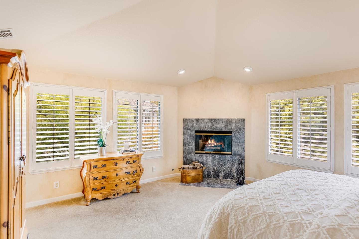 757 Harry Road San Jose, CA 95120 - Photo 38 of 60 a bedroom with furniture and a fireplace