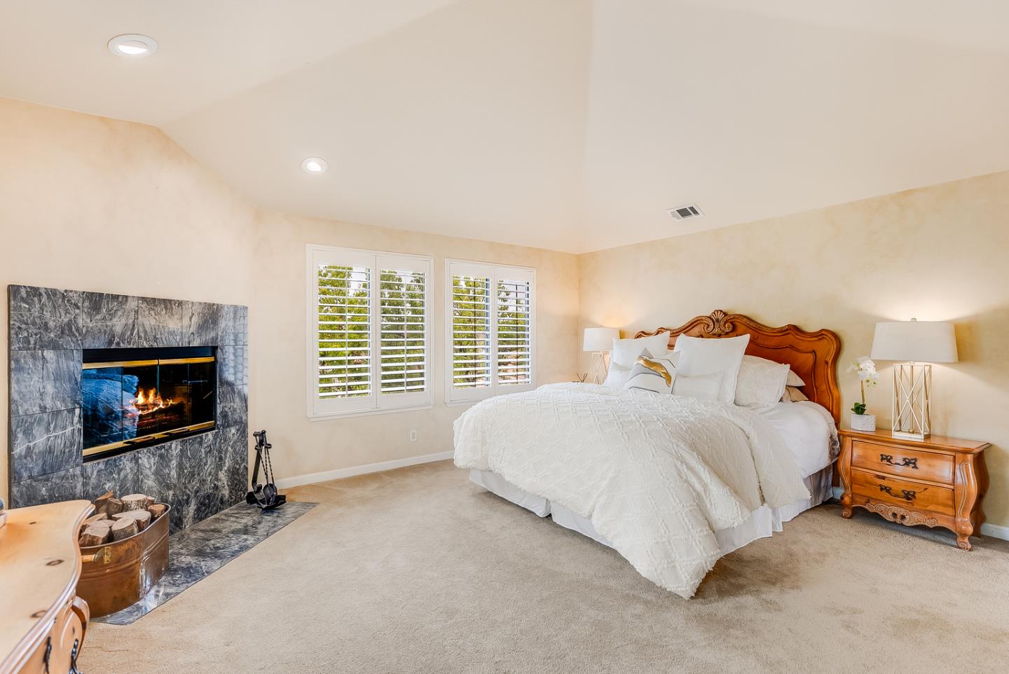 757 Harry Road San Jose, CA 95120 - Photo 39 of 60 a bedroom with a bed and a fireplace