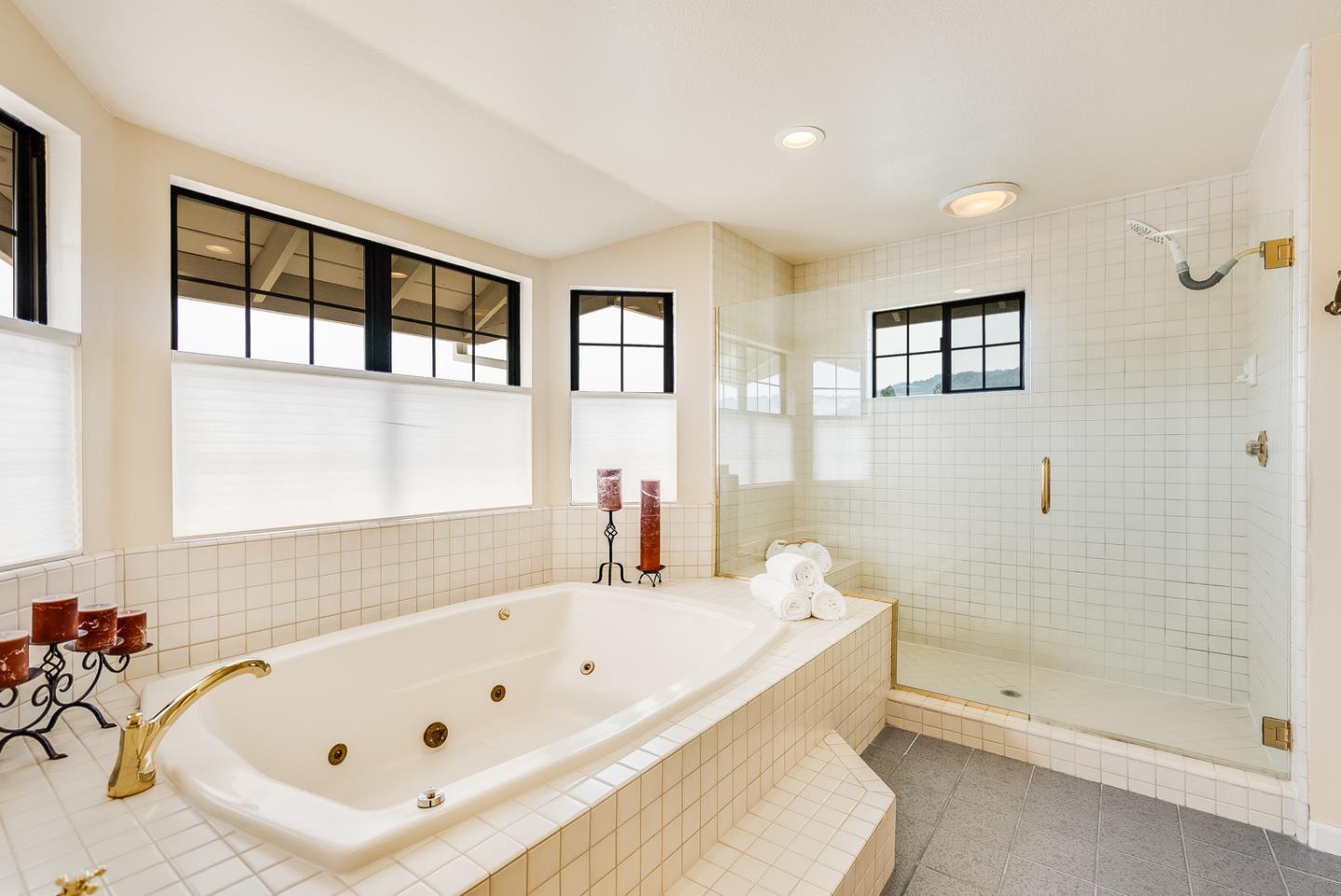 757 Harry Road San Jose, CA 95120 - Photo 43 of 60 a bathroom with a bathtub and a shower