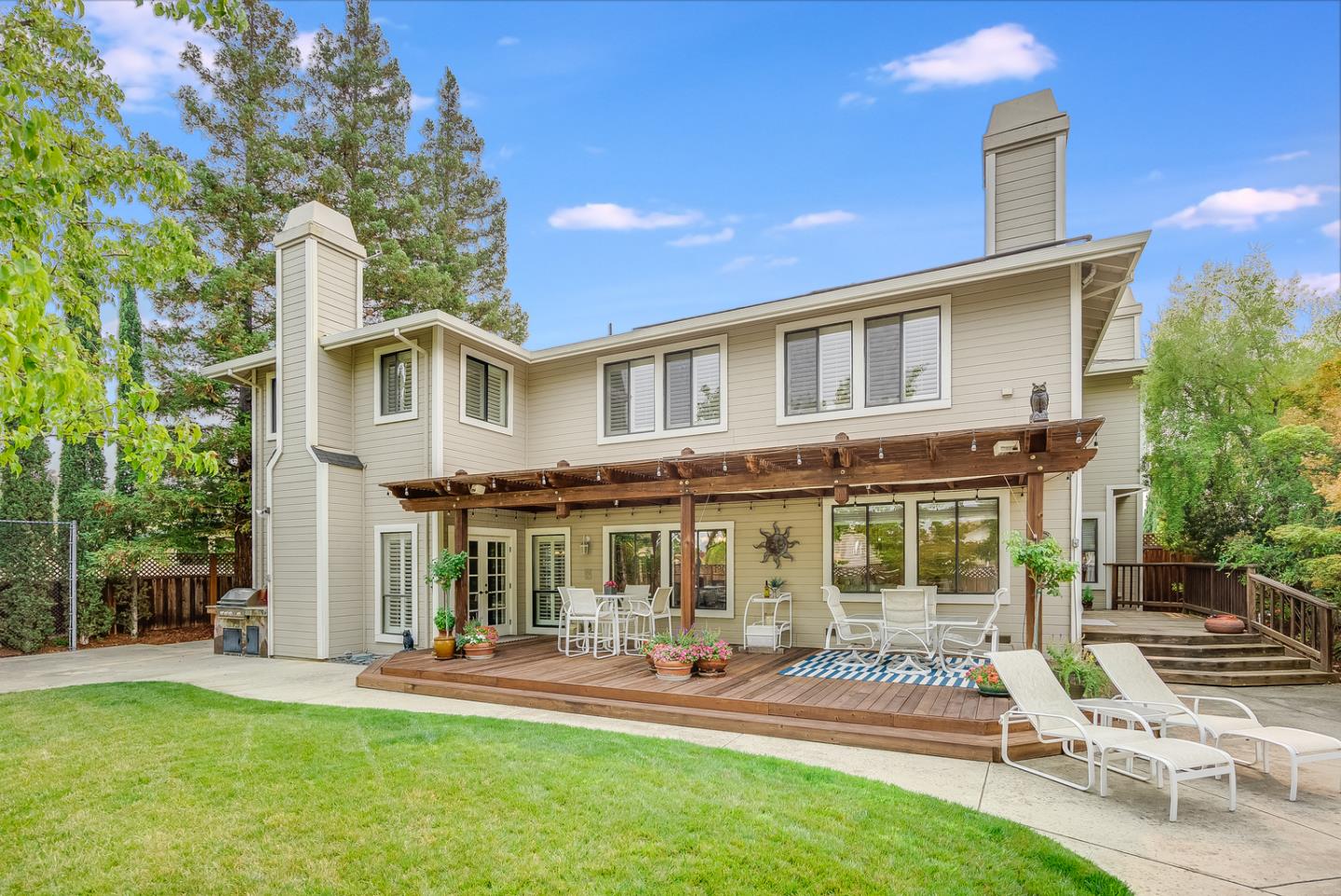 757 Harry Road San Jose, CA 95120 - Photo 48 of 60 a front view of a house with swimming pool and chairs