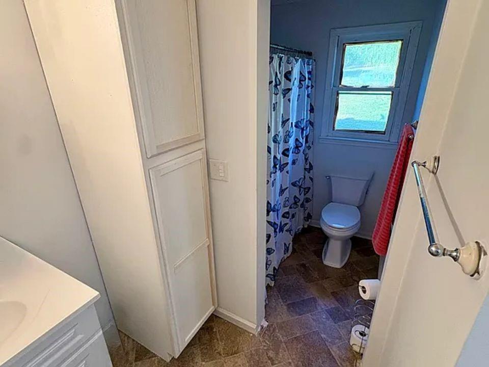 781 Thomas Street Roopville, GA 30170 - Photo 9 of 14 a view of a room with wooden floor and chair