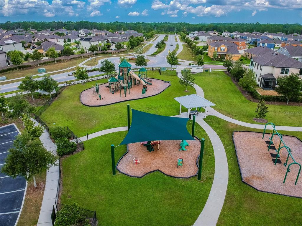1192 Multiflora Loop Lutz, FL 33558 - Photo 31 of 32 an aerial view of a swimming pool with a yard