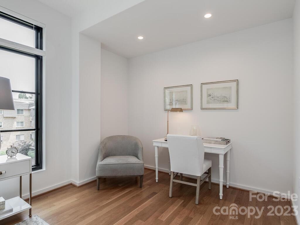 1333 Queens Road, Unit C3 Charlotte, NC 28207 - Photo 11 of 15 a living room with furniture and a window