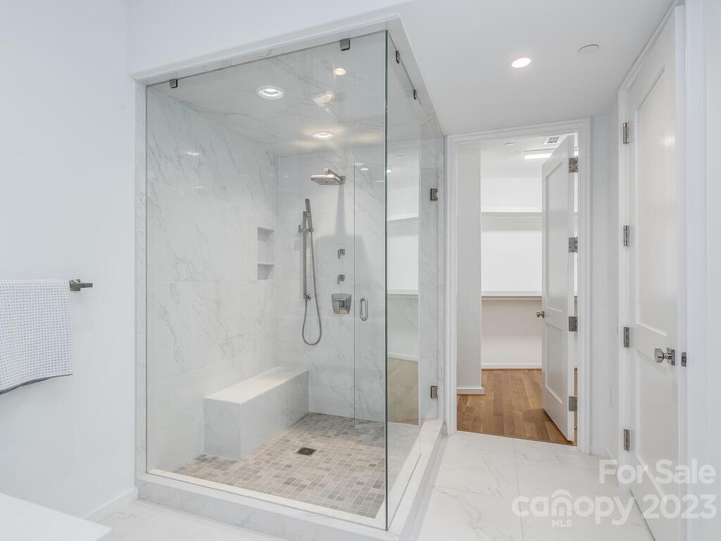 1333 Queens Road, Unit C3 Charlotte, NC 28207 - Photo 13 of 15 a bathroom with a shower and a glass door