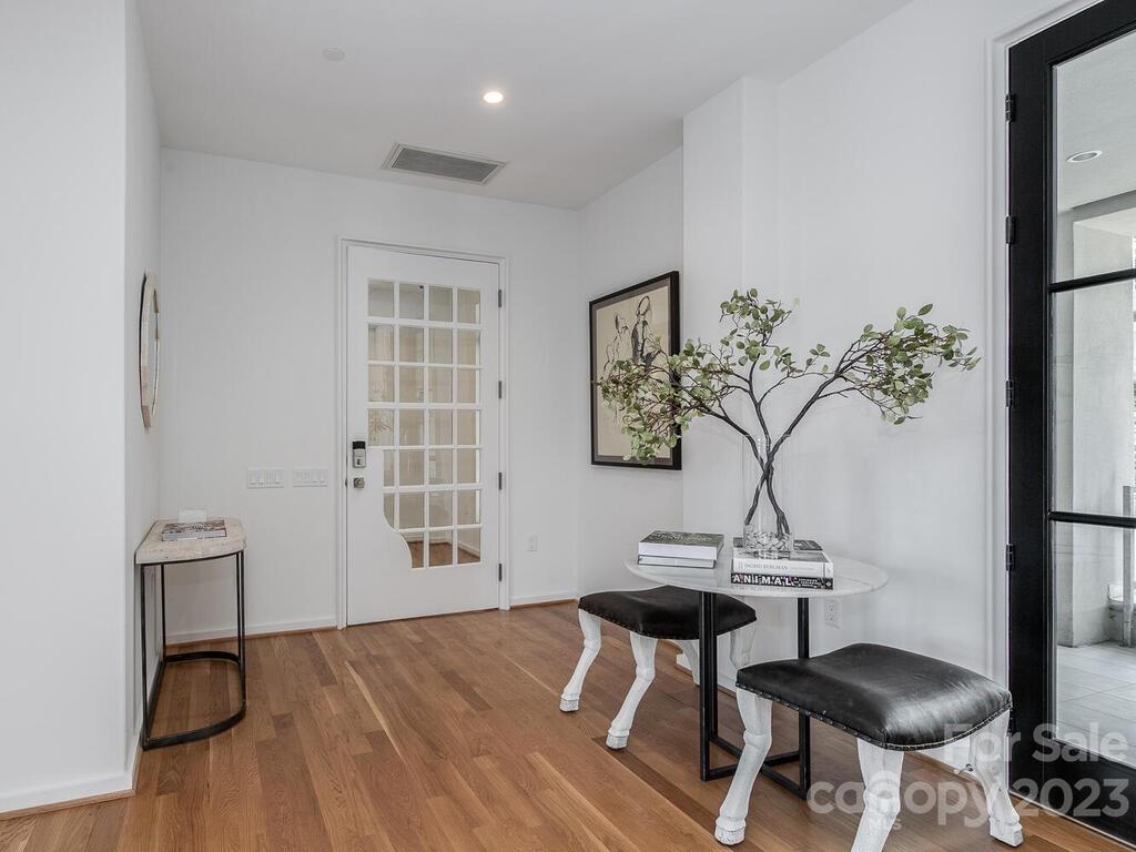 1333 Queens Road, Unit C3 Charlotte, NC 28207 - Photo 3 of 15 a view of a room with a table and chairs