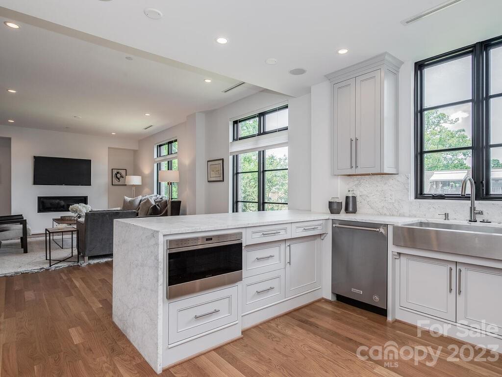 1333 Queens Road, Unit C3 Charlotte, NC 28207 - Photo 8 of 15 a kitchen with a stove a sink and a microwave