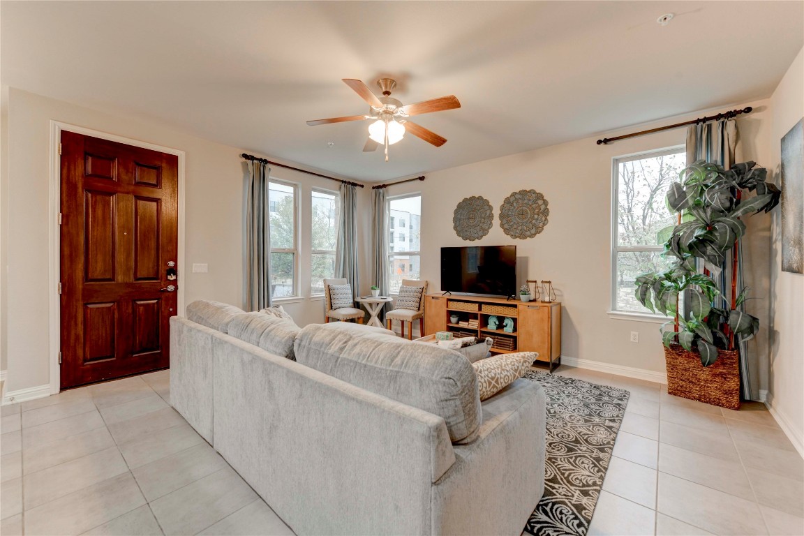 13800 Lyndhurst Street, Unit 125 Austin, TX 78717 - Photo 14 of 27 a living room with furniture and a large window