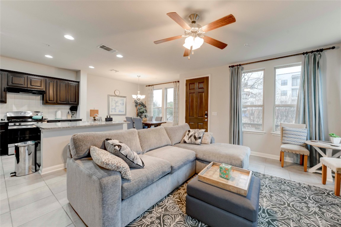 13800 Lyndhurst Street, Unit 125 Austin, TX 78717 - Photo 15 of 27 a living room with furniture and a flat screen tv