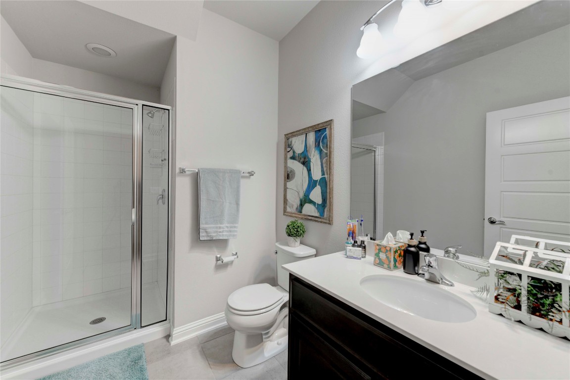 13800 Lyndhurst Street, Unit 125 Austin, TX 78717 - Photo 19 of 27 a bathroom with a sink toilet vanity and shower