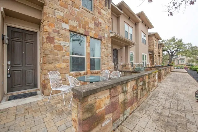 a view of a brick building with many windows