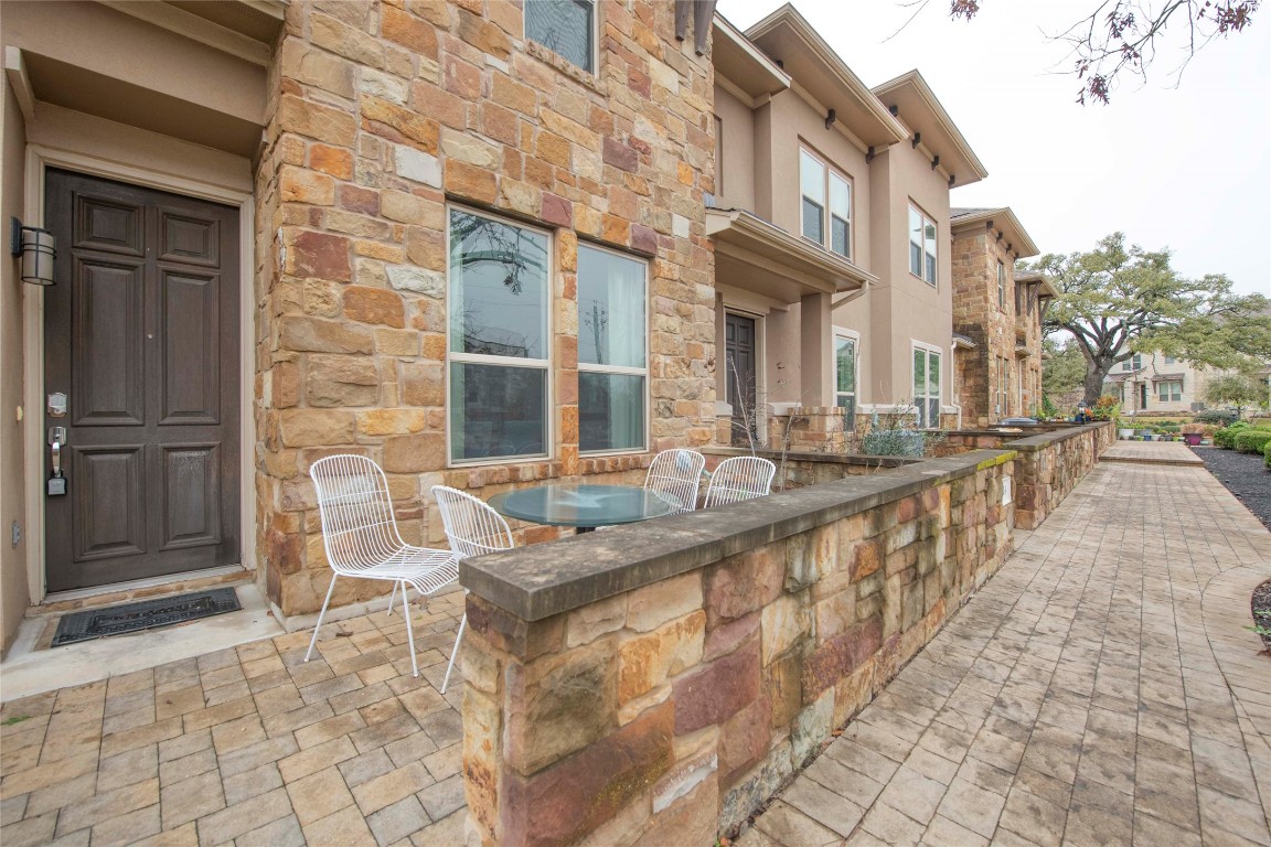 13800 Lyndhurst Street, Unit 125 Austin, TX 78717 - Photo 2 of 27 a view of a brick building with many windows