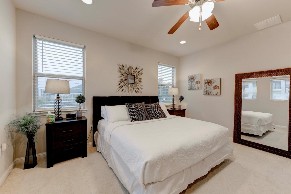 13800 Lyndhurst Street, Unit 125 Austin, TX 78717 - Photo 5 of 27 a bedroom with a bed and a painting on the wall