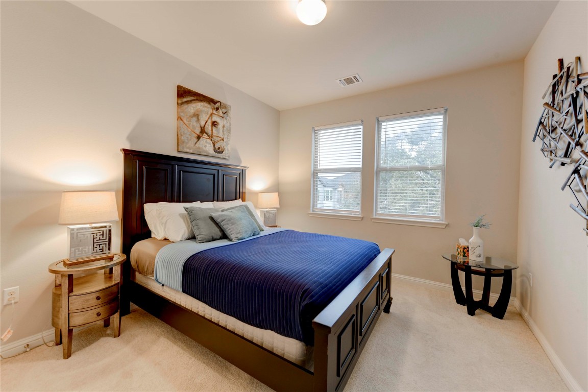 13800 Lyndhurst Street, Unit 125 Austin, TX 78717 - Photo 7 of 27 a bed room with a bed and a window