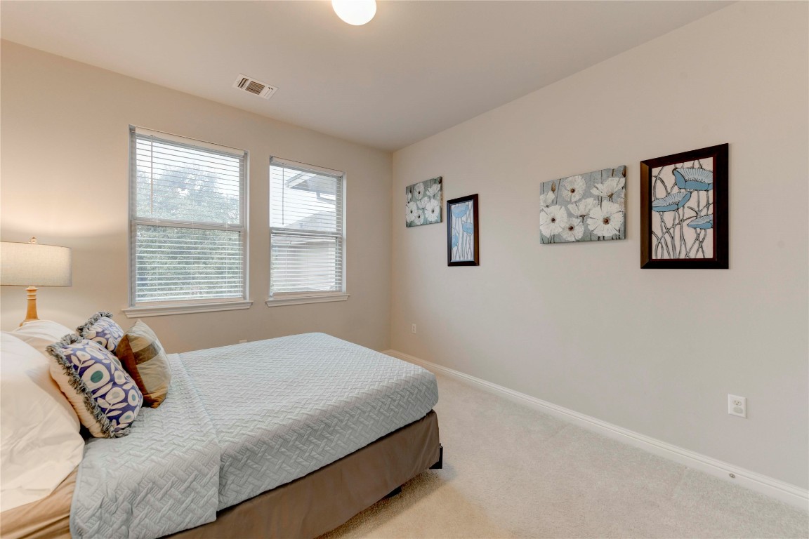 13800 Lyndhurst Street, Unit 125 Austin, TX 78717 - Photo 9 of 27 a bedroom with a bed and a window