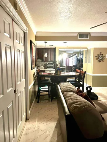 a view of a living room and dining room