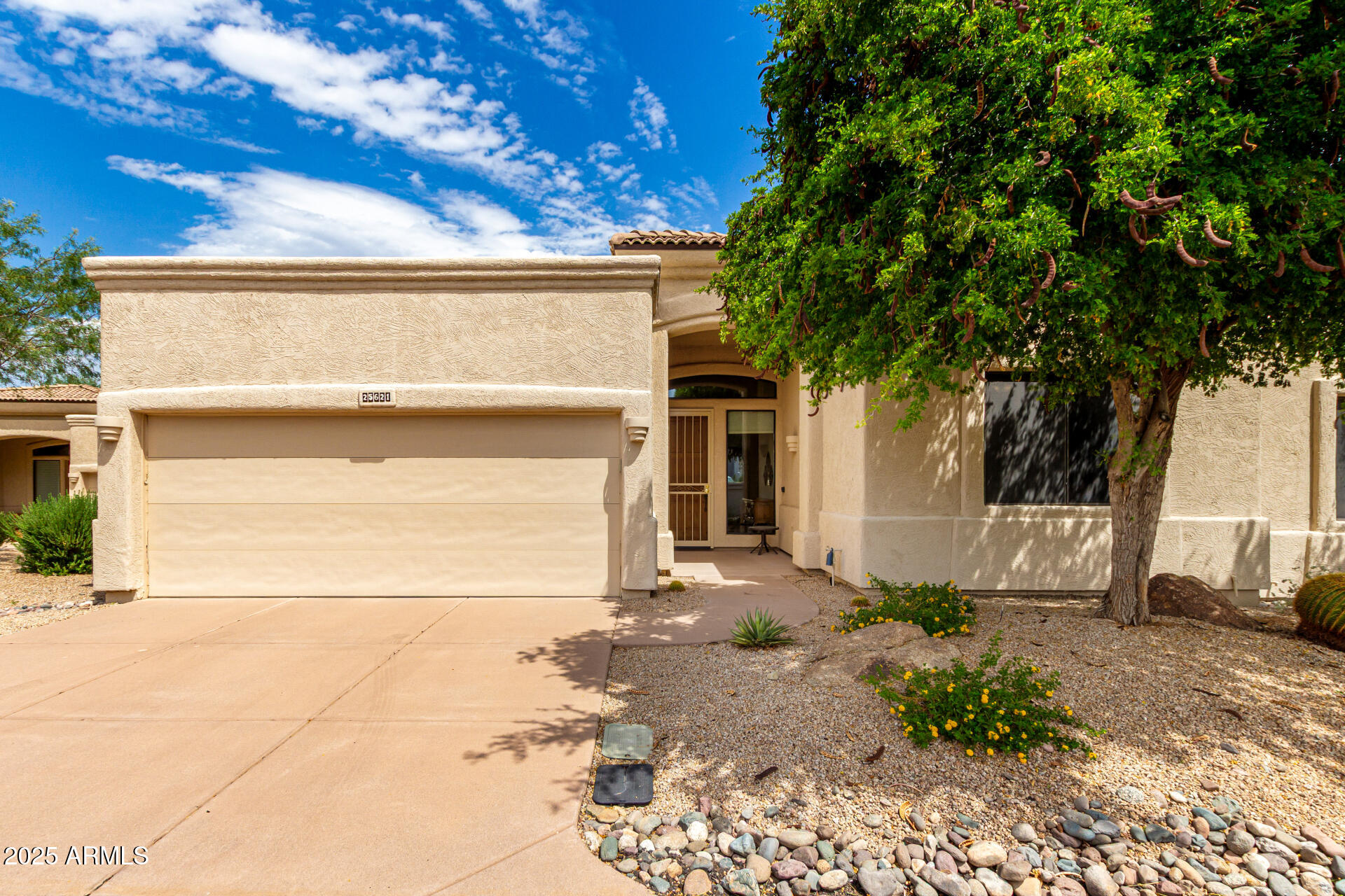 25621 North Sago Drive Rio Verde, AZ 85263 - Photo 1 of 45 a front view of a house with a yard
