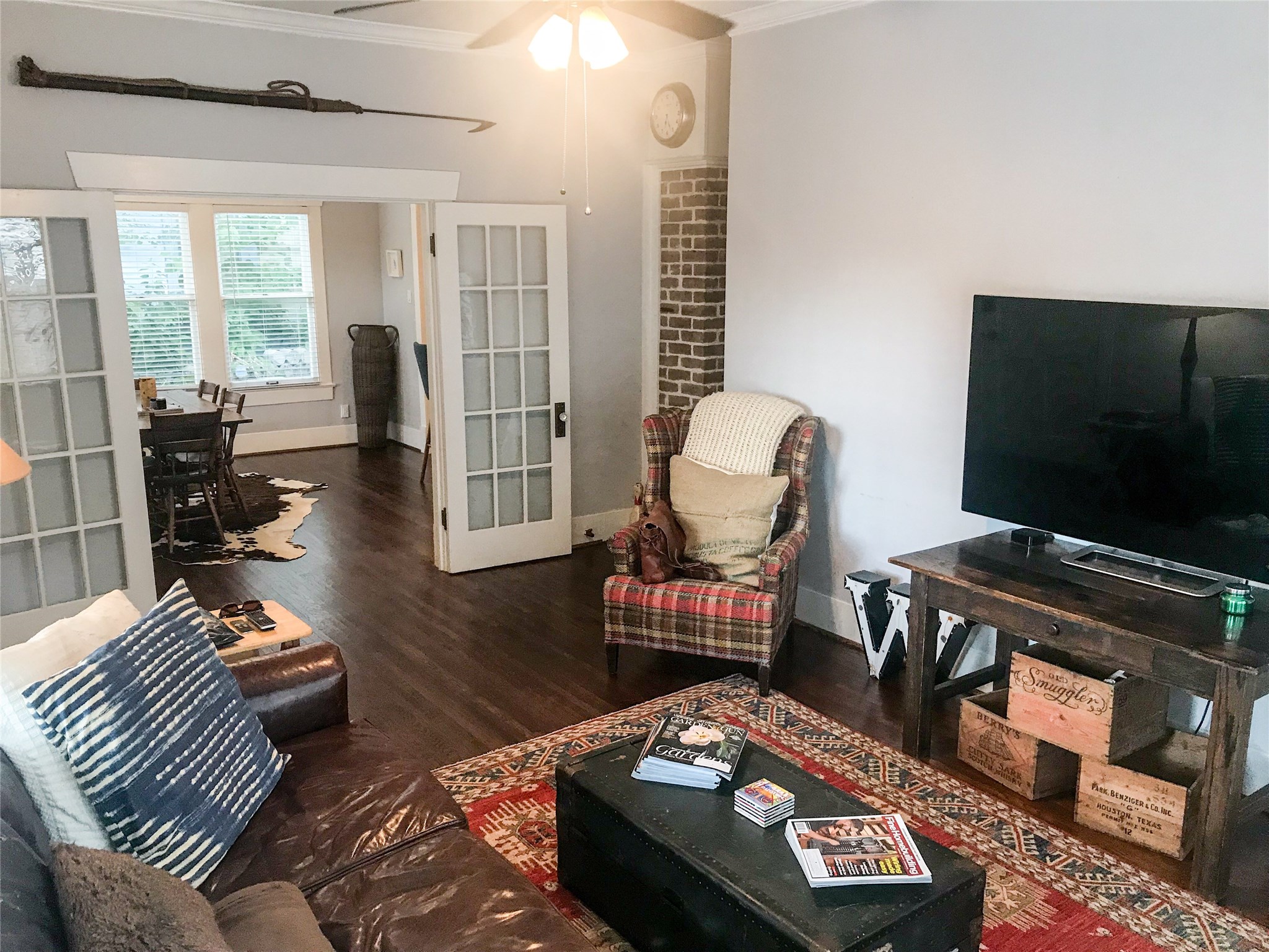 210 Tabor Street Houston, TX 77009 - Photo 3 of 20 a living room with furniture and a flat screen tv