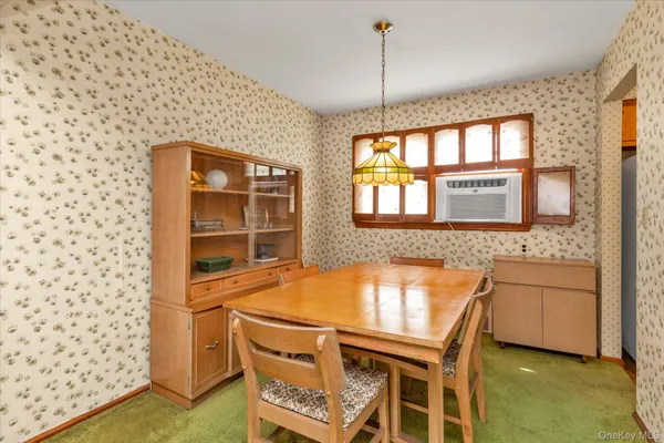 a room with a table and chairs