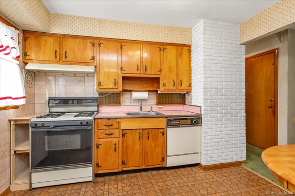a kitchen with a stove and a sink