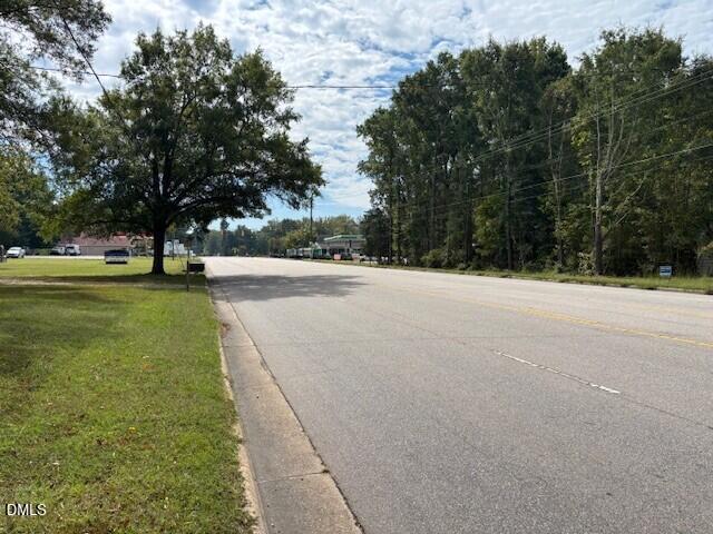 13011 North Roxboro Street Rougemont, NC 27572 - Photo 2 of 3 a street view with large trees