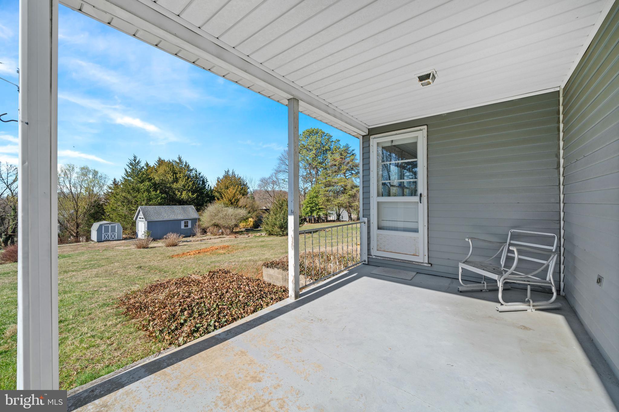 1005 Nottingham Road Newark, DE 19711 - Photo 21 of 47 a view of a porch with furniture and garden