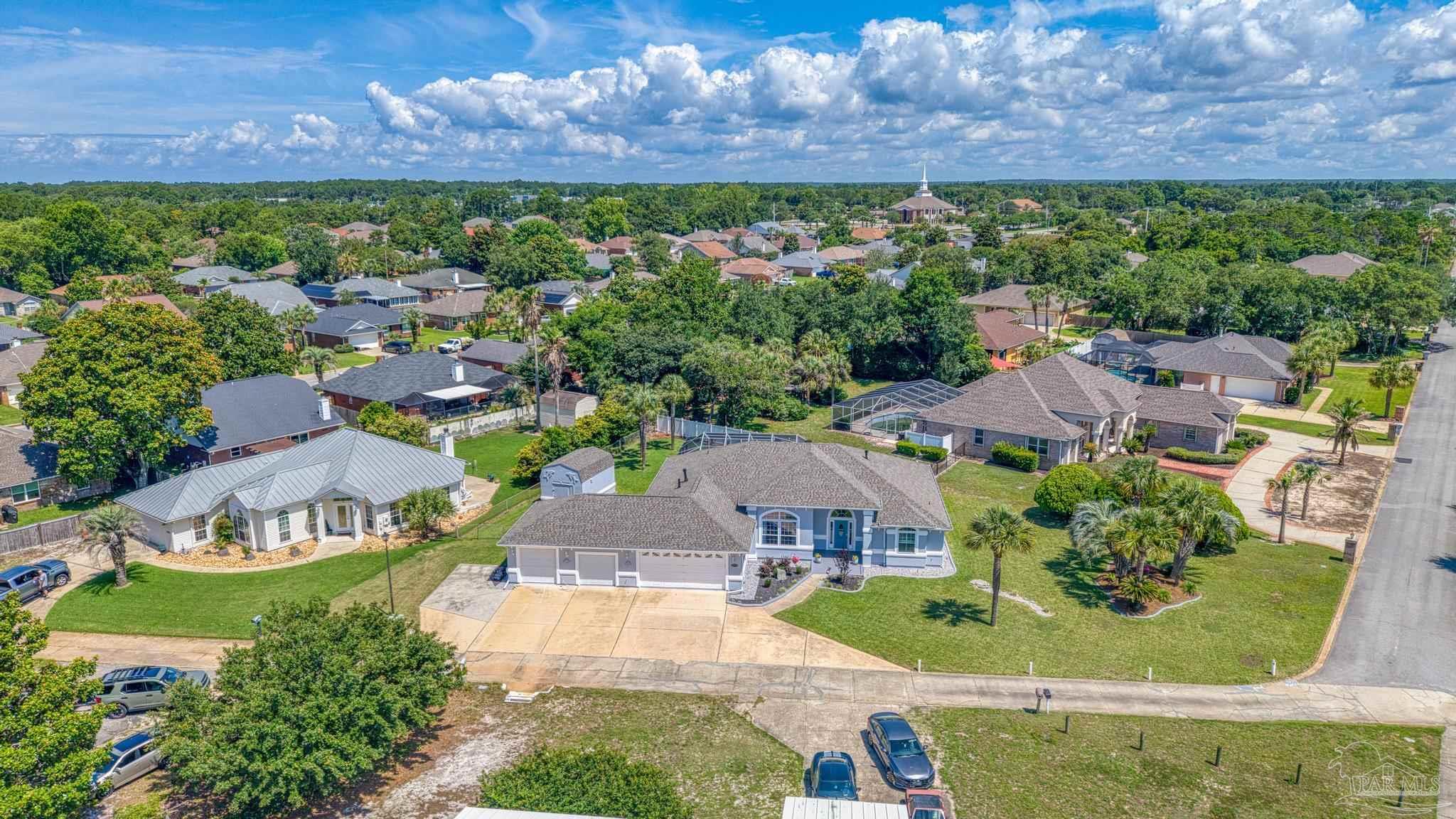 2005 Riviera Lane South Navarre, FL 32566 - Photo 57 of 70 an aerial view of residential houses with outdoor space and street view