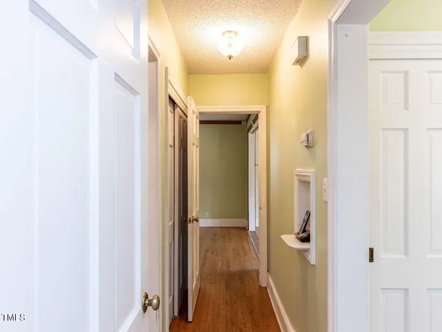a bathroom with a sink a toilet a mirror and shower