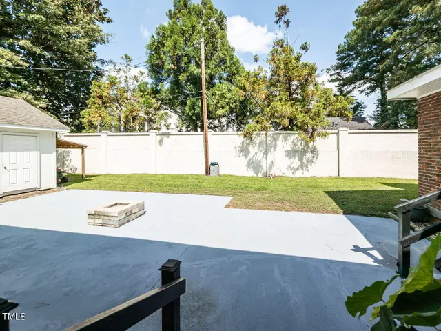 a front view of a house with a yard table and chairs
