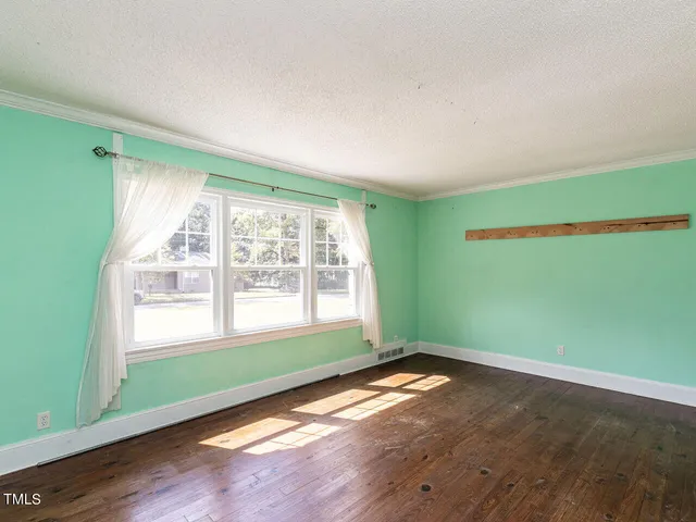 a kitchen with stainless steel appliances a sink stove and cabinets