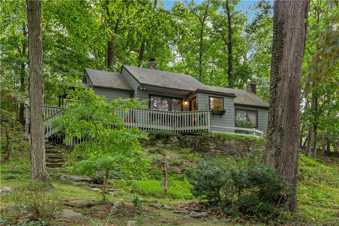 18 Stanwood Road Mount Kisco, NY 10549 - Photo 1 of 1 Cottage perched on a hill in the woods.