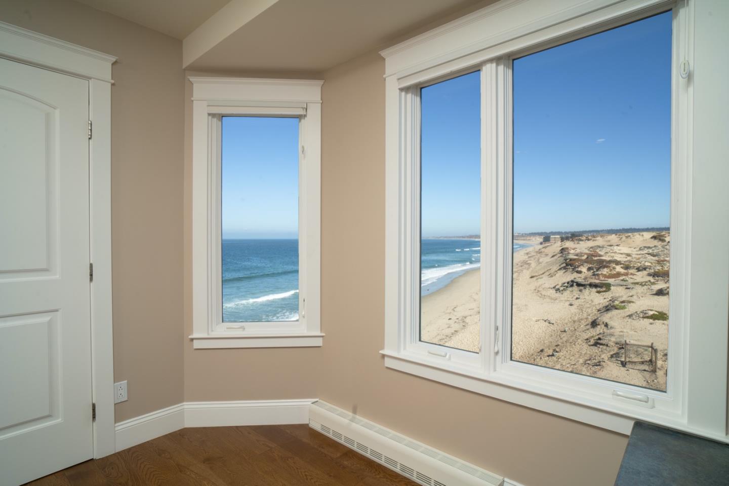1 Surf Way, Unit 240 Monterey, CA 93940 - Photo 12 of 29 a view of a bedroom that has a window in it