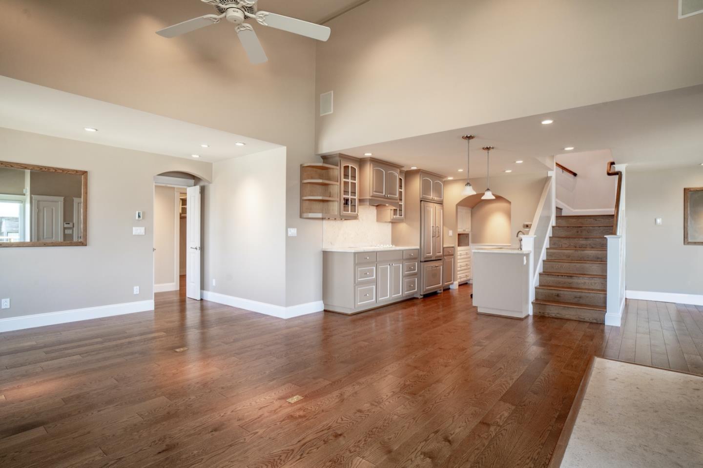 1 Surf Way, Unit 240 Monterey, CA 93940 - Photo 5 of 29 a view of an empty room with wooden floor and stairs