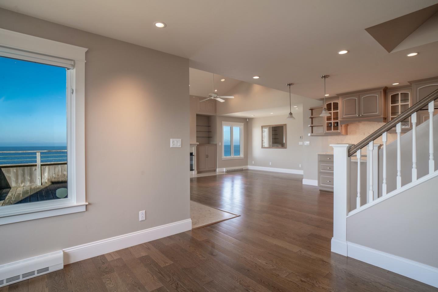 1 Surf Way, Unit 240 Monterey, CA 93940 - Photo 6 of 29 a view of a livingroom with wooden floor and staircase