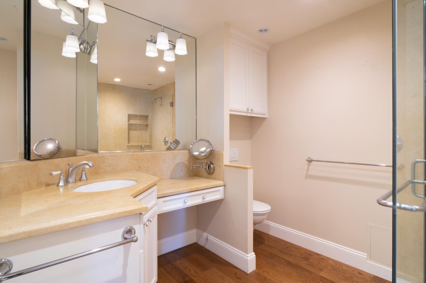1 Surf Way, Unit 240 Monterey, CA 93940 - Photo 10 of 29 a bathroom with a sink and a mirror