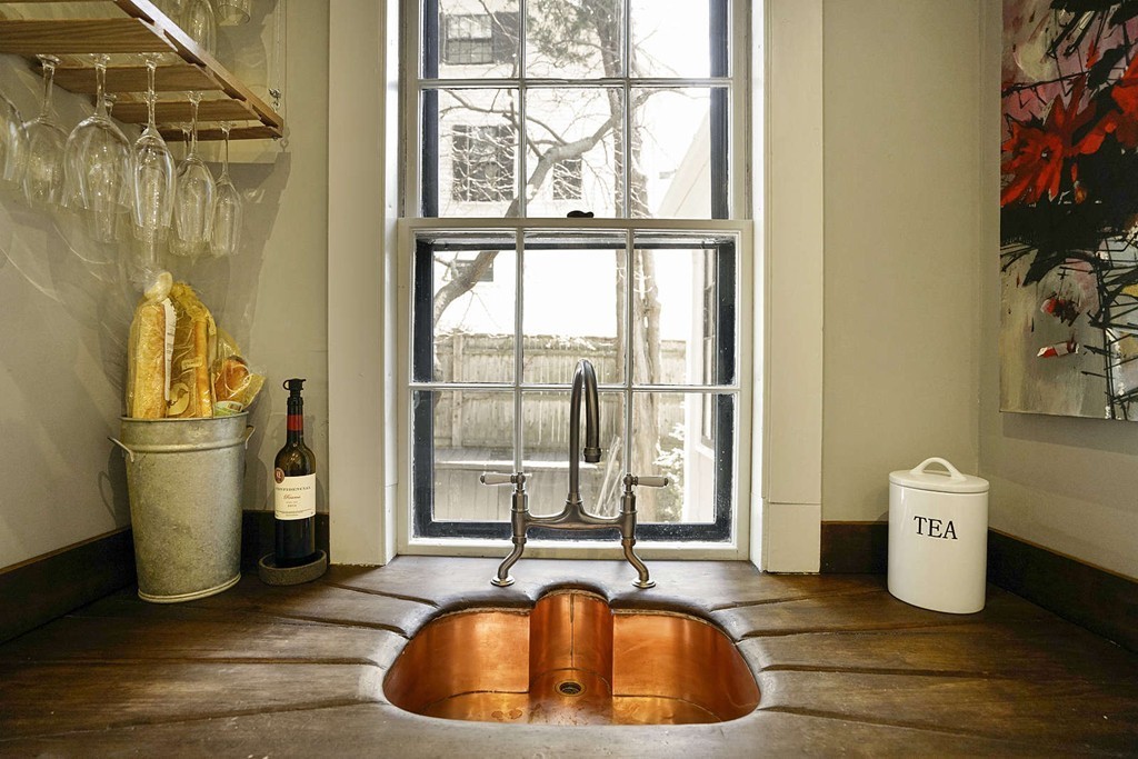 173 School Street Milton, MA 02186 - Photo 13 of 30 a view of a kitchen with a sink and dishwasher