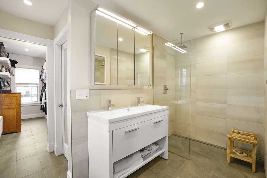 173 School Street Milton, MA 02186 - Photo 19 of 30 a bathroom with a sink a toilet and a mirror