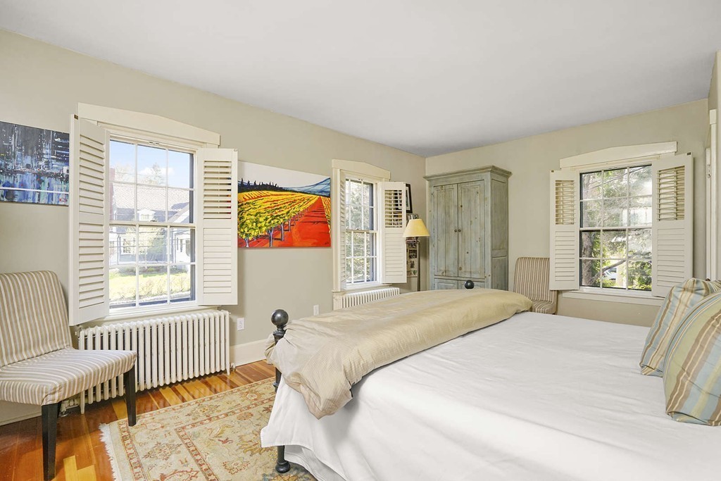 173 School Street Milton, MA 02186 - Photo 20 of 30 a bedroom with a bed and a large window