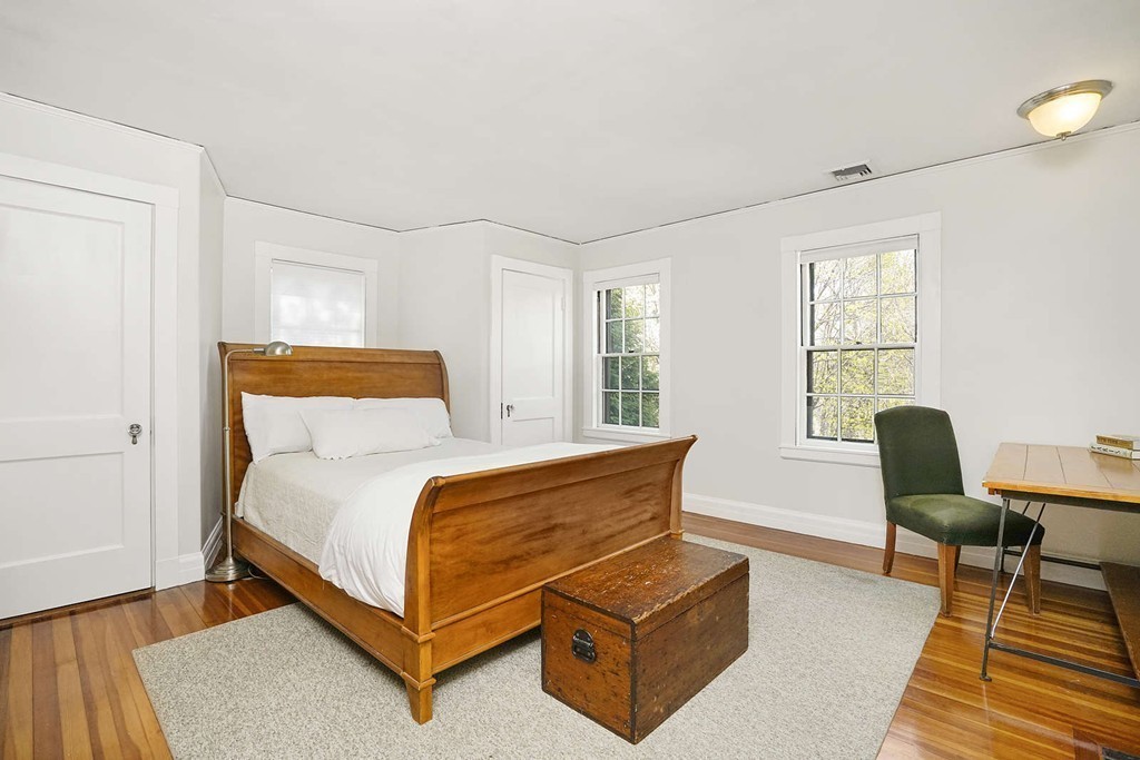 173 School Street Milton, MA 02186 - Photo 22 of 30 a bedroom with a bed and chair