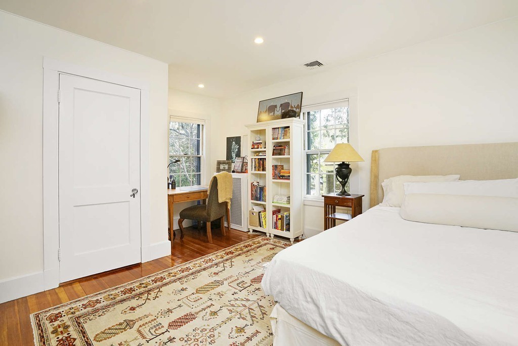 173 School Street Milton, MA 02186 - Photo 24 of 30 a bedroom with a large bed and a closet