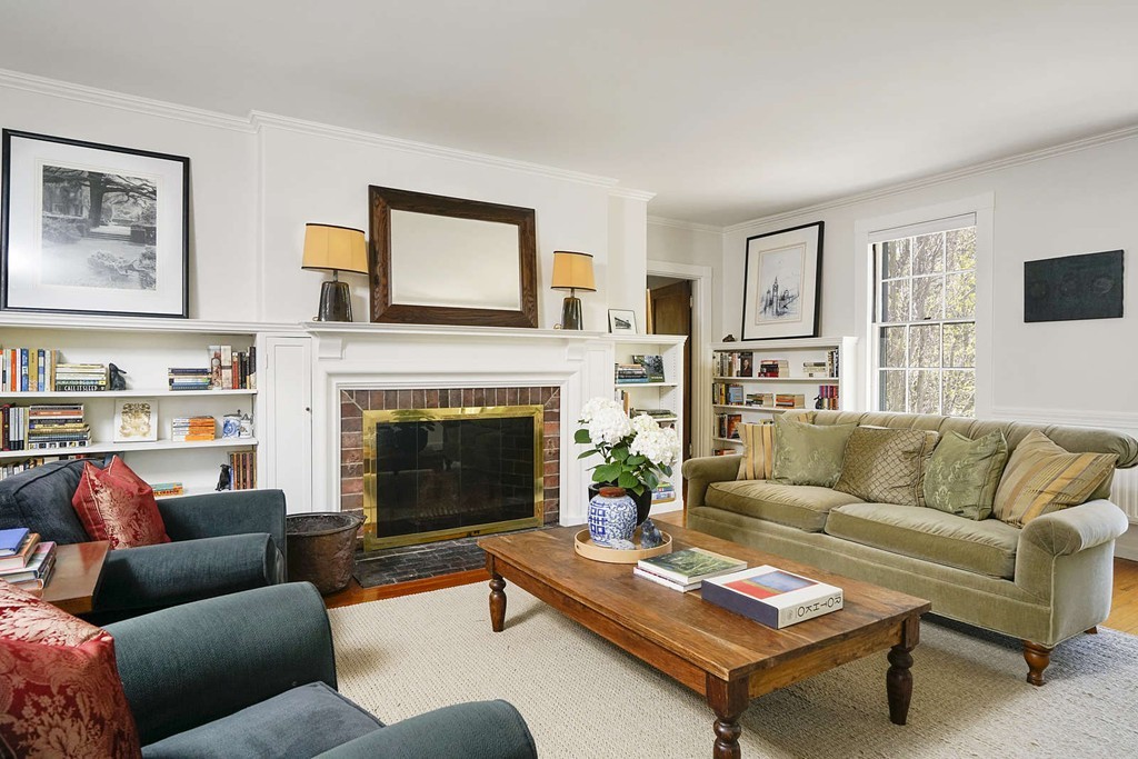 173 School Street Milton, MA 02186 - Photo 5 of 30 a living room with furniture and a fireplace