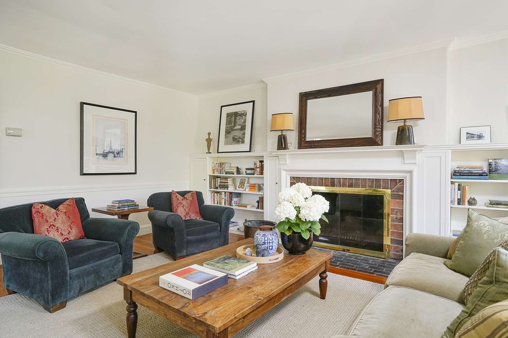 173 School Street Milton, MA 02186 - Photo 6 of 30 a living room with furniture and a fireplace