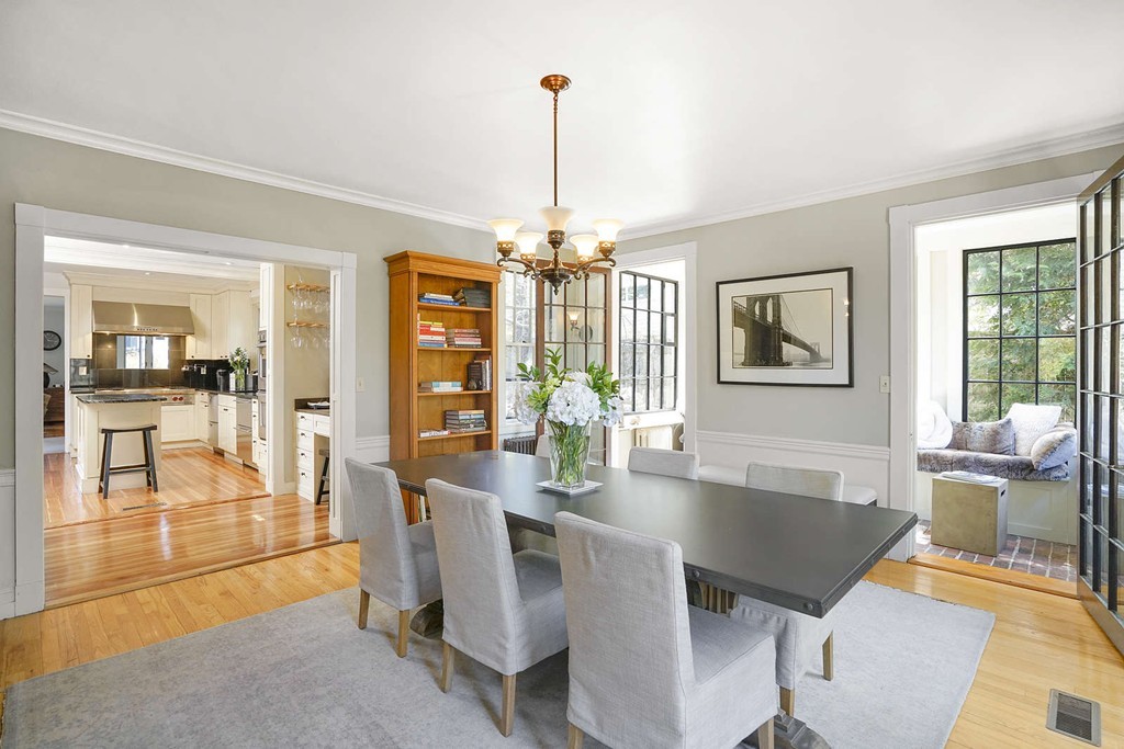 173 School Street Milton, MA 02186 - Photo 8 of 30 a view of a dining room with furniture wooden floor and chandelier