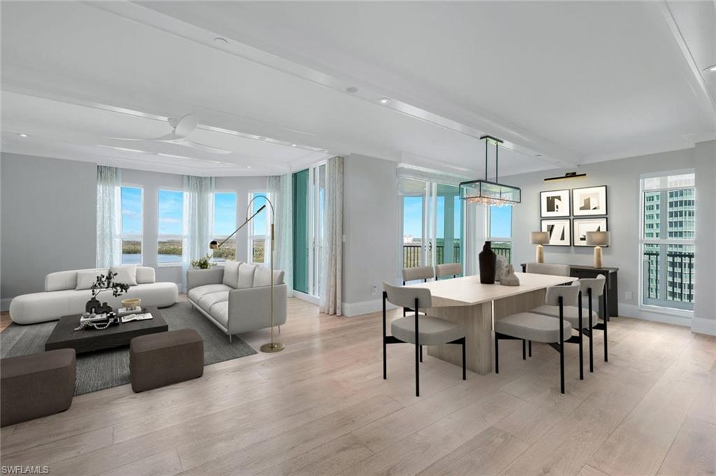a living room with furniture wooden floor and potted plant