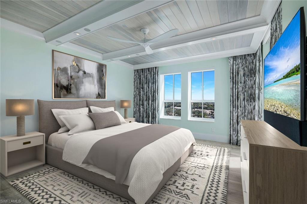 285 Grande Way, Unit 1006 Naples, FL 34110 - Photo 15 of 46 a bedroom with a large bed and a flat screen tv