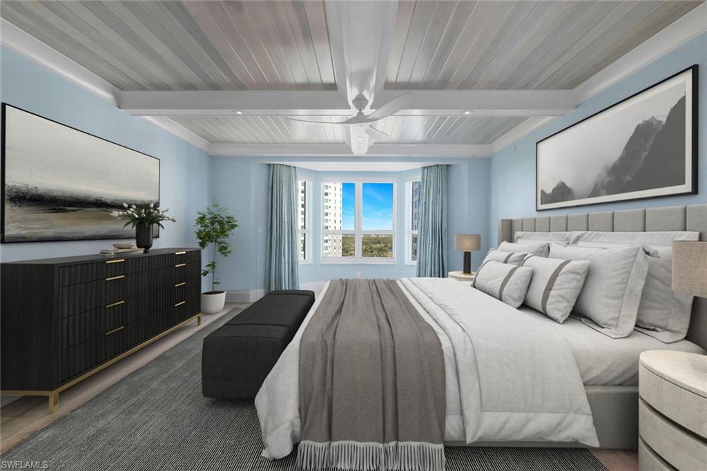 285 Grande Way, Unit 1006 Naples, FL 34110 - Photo 7 of 46 a bedroom with a large bed and a flat tv screen on dresser