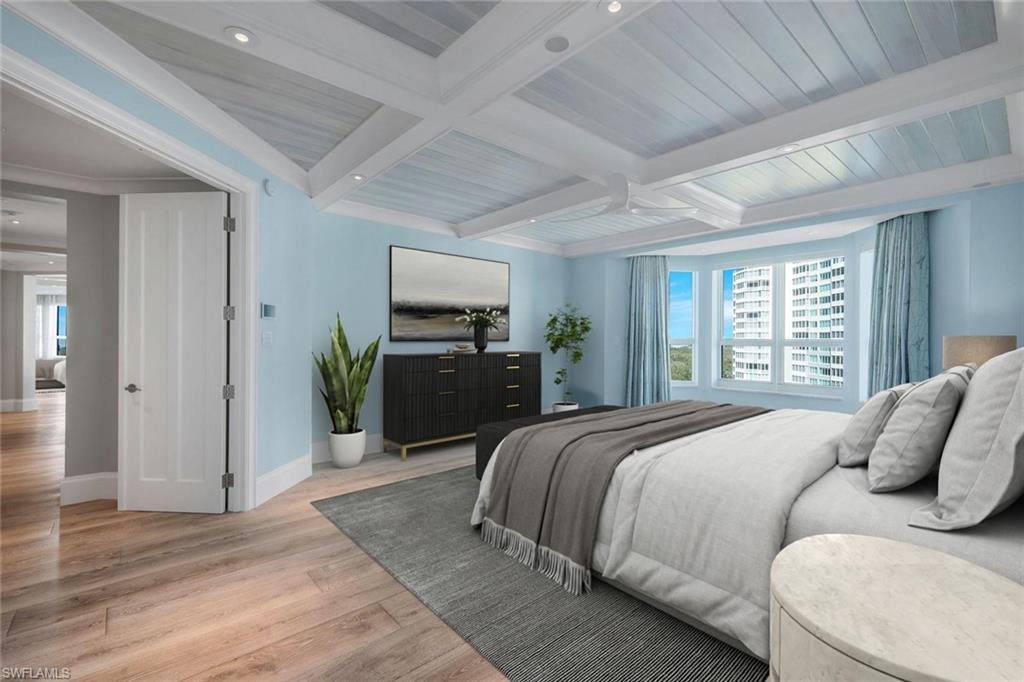 285 Grande Way, Unit 1006 Naples, FL 34110 - Photo 8 of 46 a bedroom with a bed flat screen tv and window