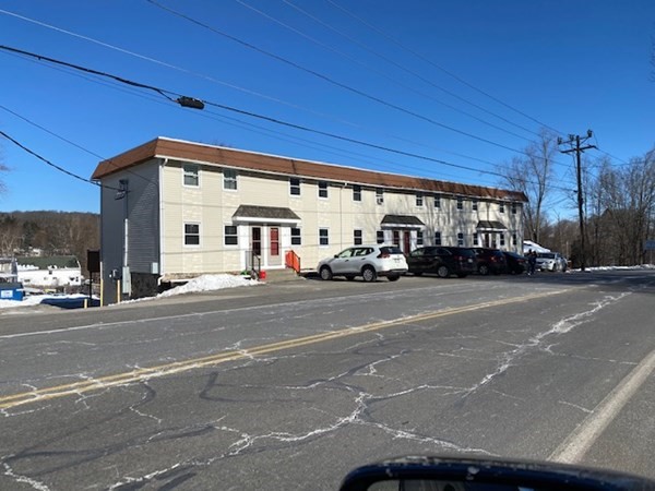 4 Providence Road Sutton, MA 01590 - Photo 1 of 14 a cars parked on the side of a street