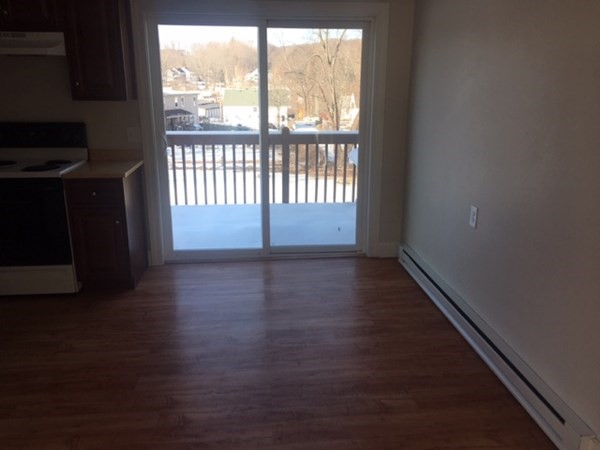 4 Providence Road Sutton, MA 01590 - Photo 12 of 14 a view of wooden floor and windows in a room