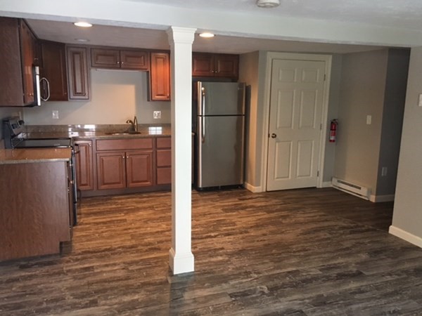 4 Providence Road Sutton, MA 01590 - Photo 5 of 14 a kitchen with a refrigerator and a sink